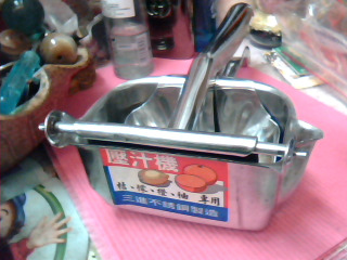 壓汁器